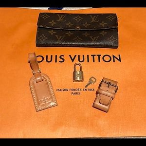 Louis Vuitton lock and key, luggage tag and wallet.